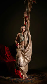 Dancer in a traditional outfit with a dark background