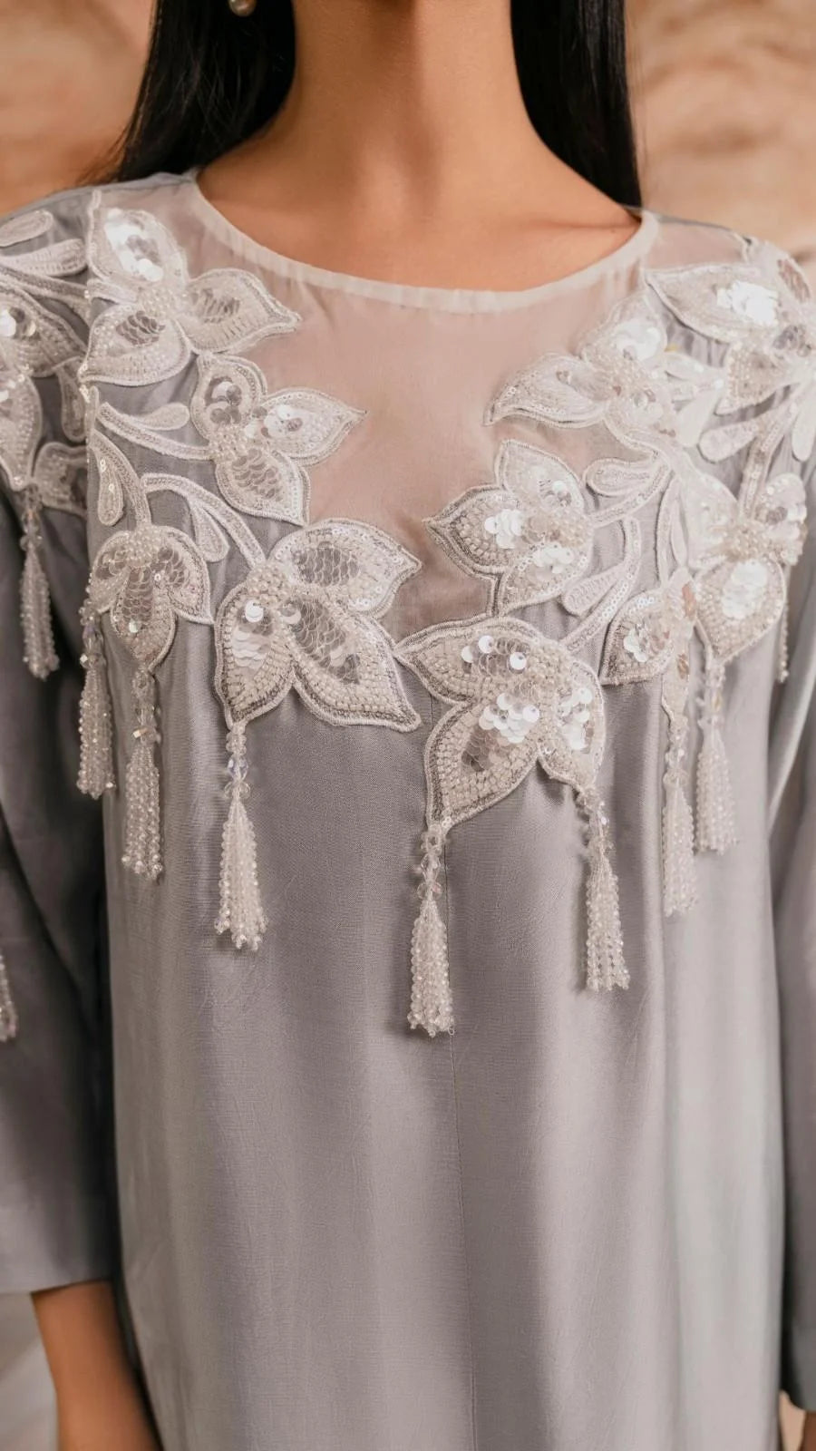 Gray top with intricate lace and bead detailing